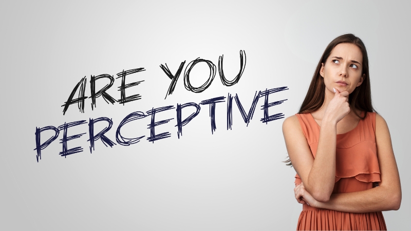 A woman stands thinking with the words “Are you perceptive” written beside her on a plain background