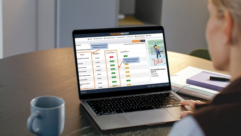 Laptop screen showing keyword research and competition data for book topics on Amazon KDP